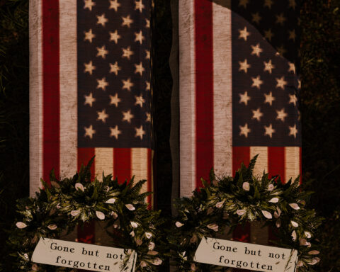 Two coffins, draped in the American flag with remembrance wreathes